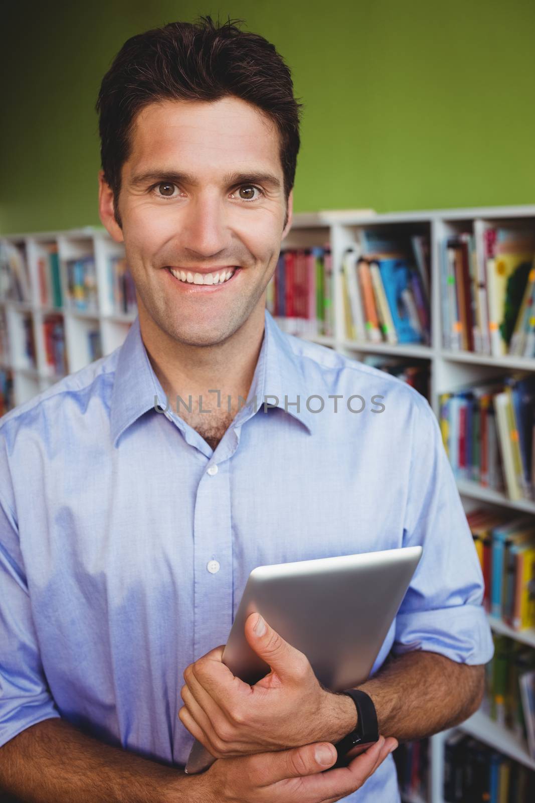 Portrait of a men holding a book by Wavebreakmedia