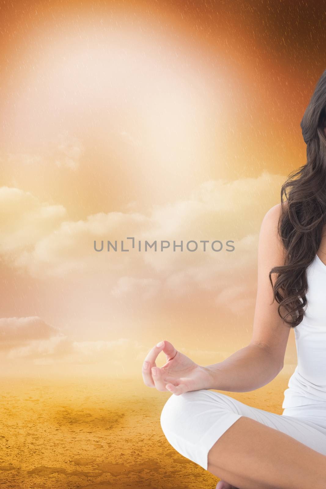 Composite image of a woman who is doing yoga in a field