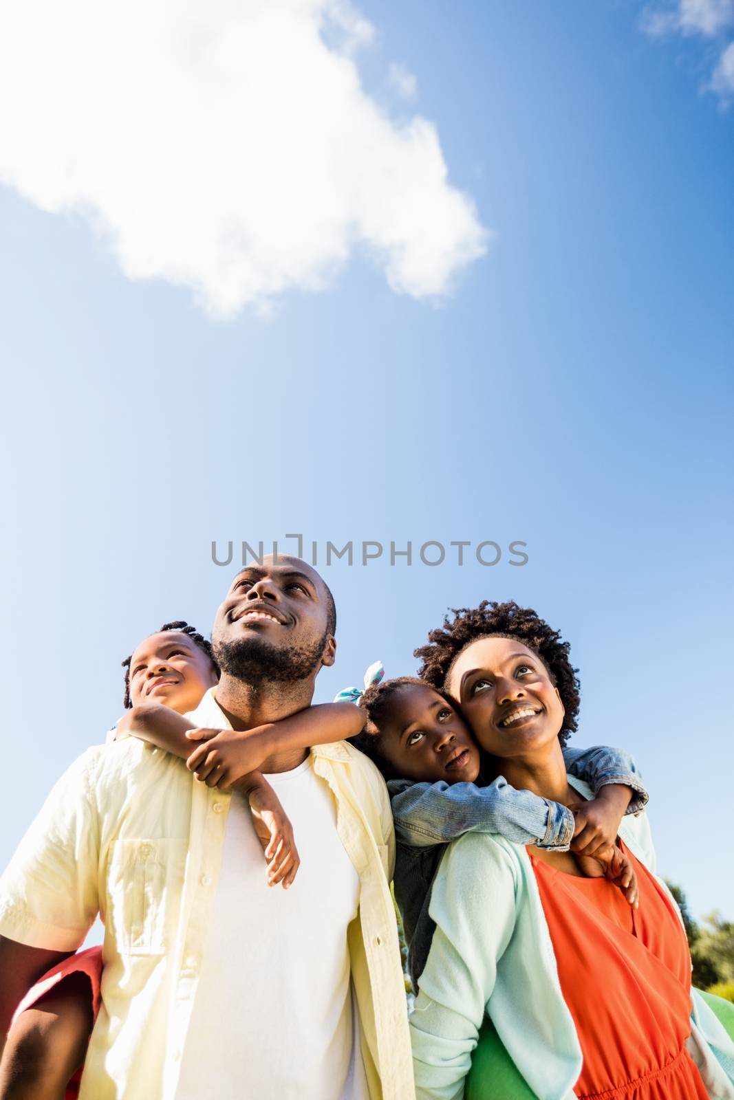 Happy family posing together by Wavebreakmedia