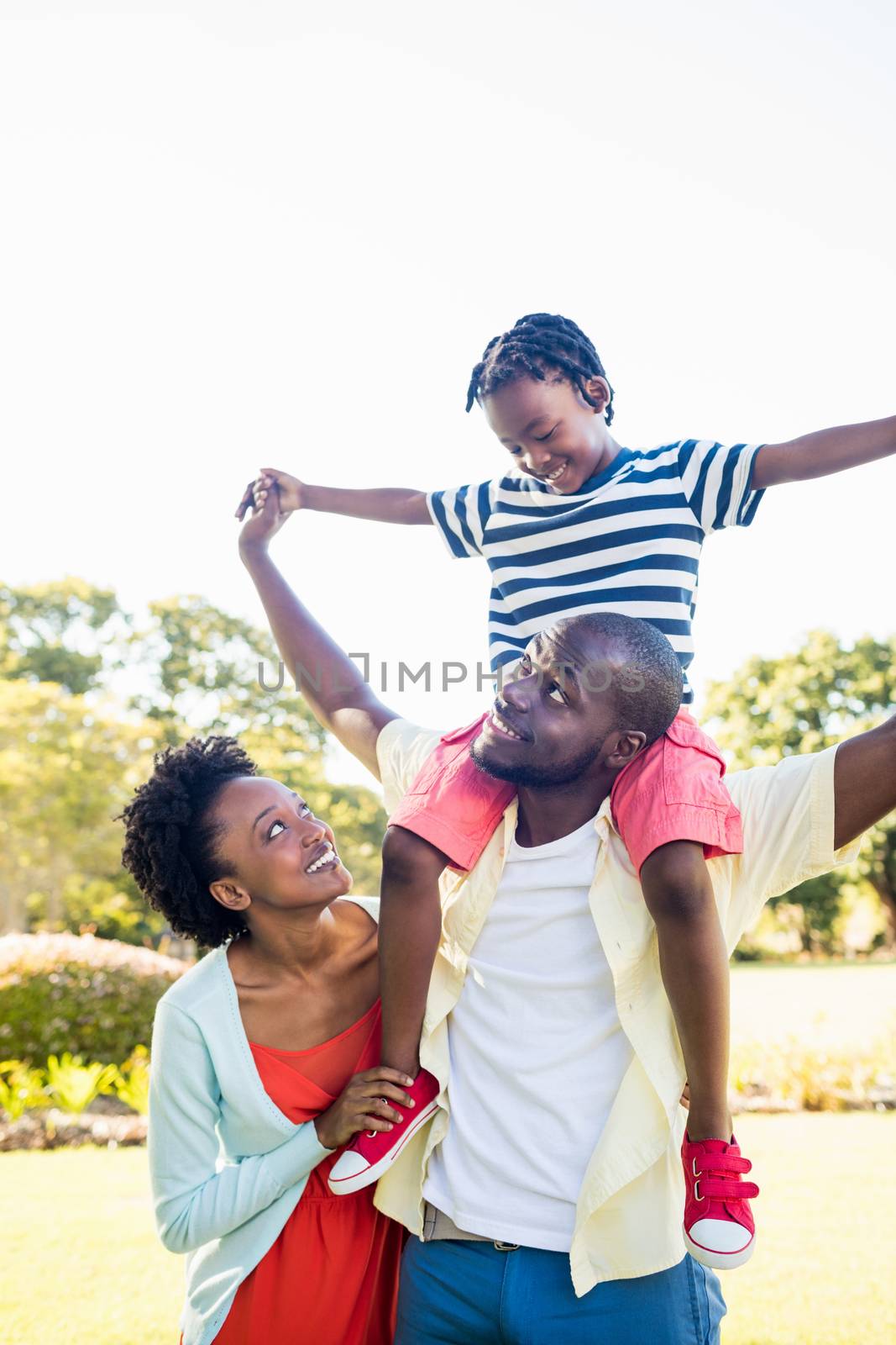 Happy family enjoying together at park