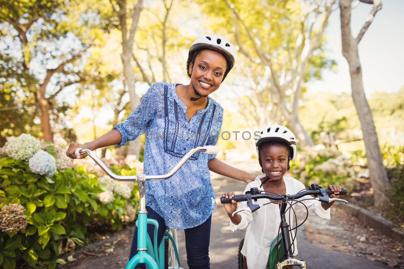 Happy family doing bicycle by Wavebreakmedia