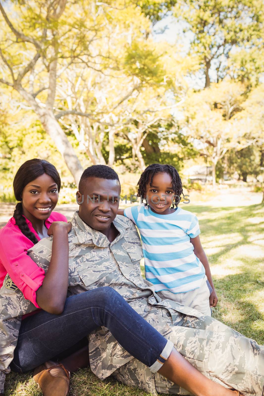 Happy family posing together at park