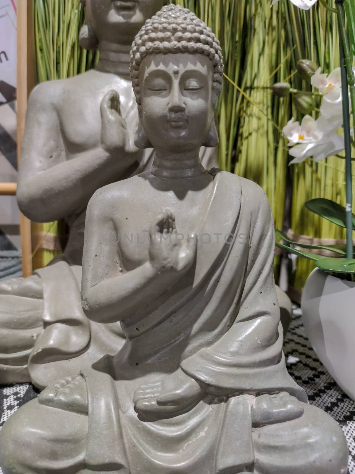 a grey statue of buddha.