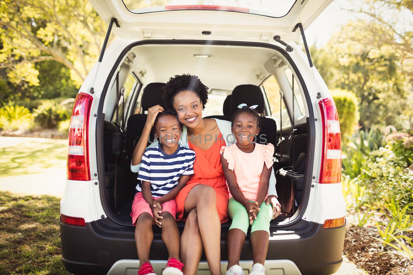 Happy family posing together by Wavebreakmedia