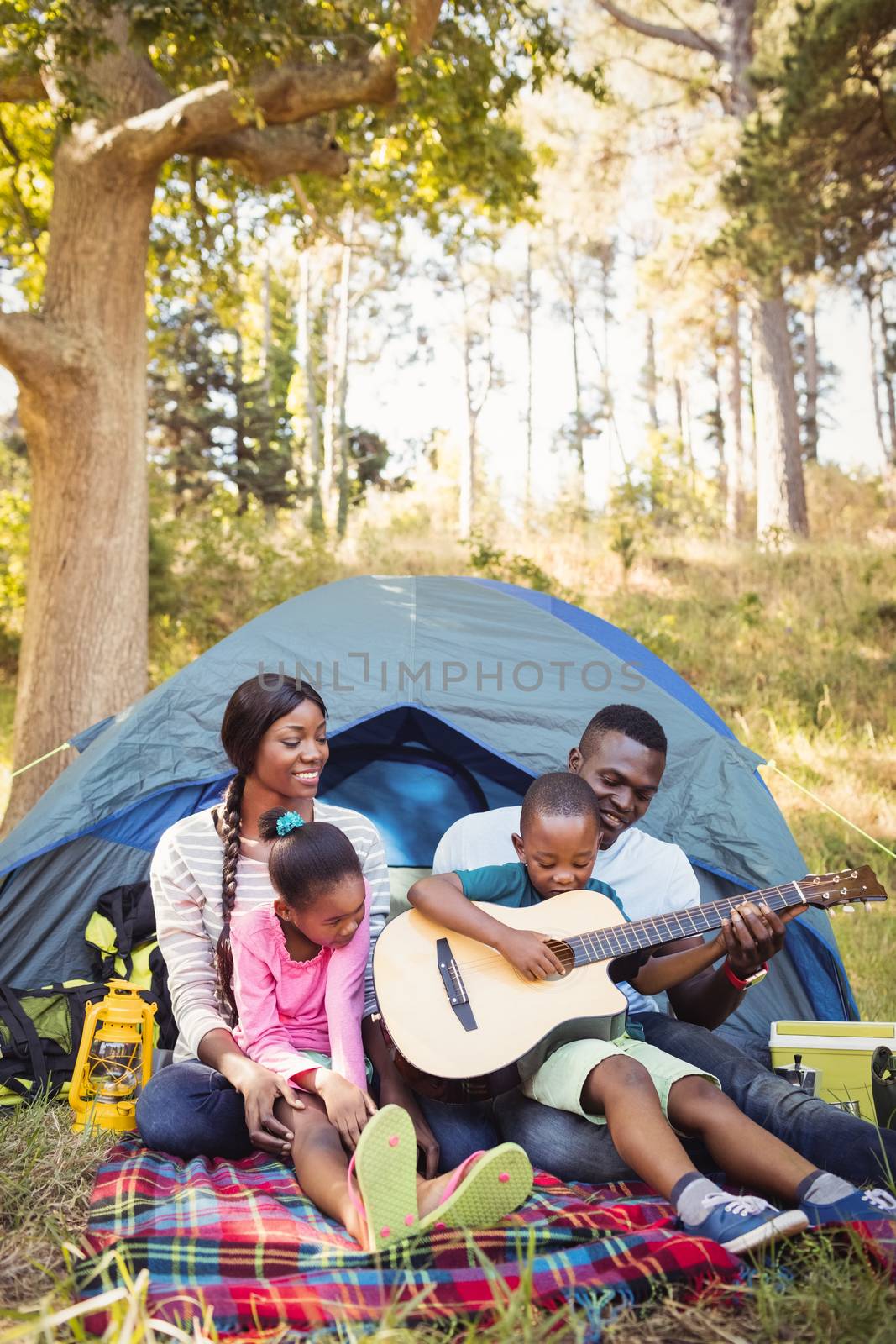 Happy family enjoying together at park