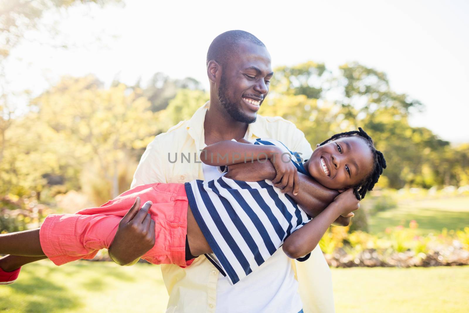 Happy family enjoying together at park