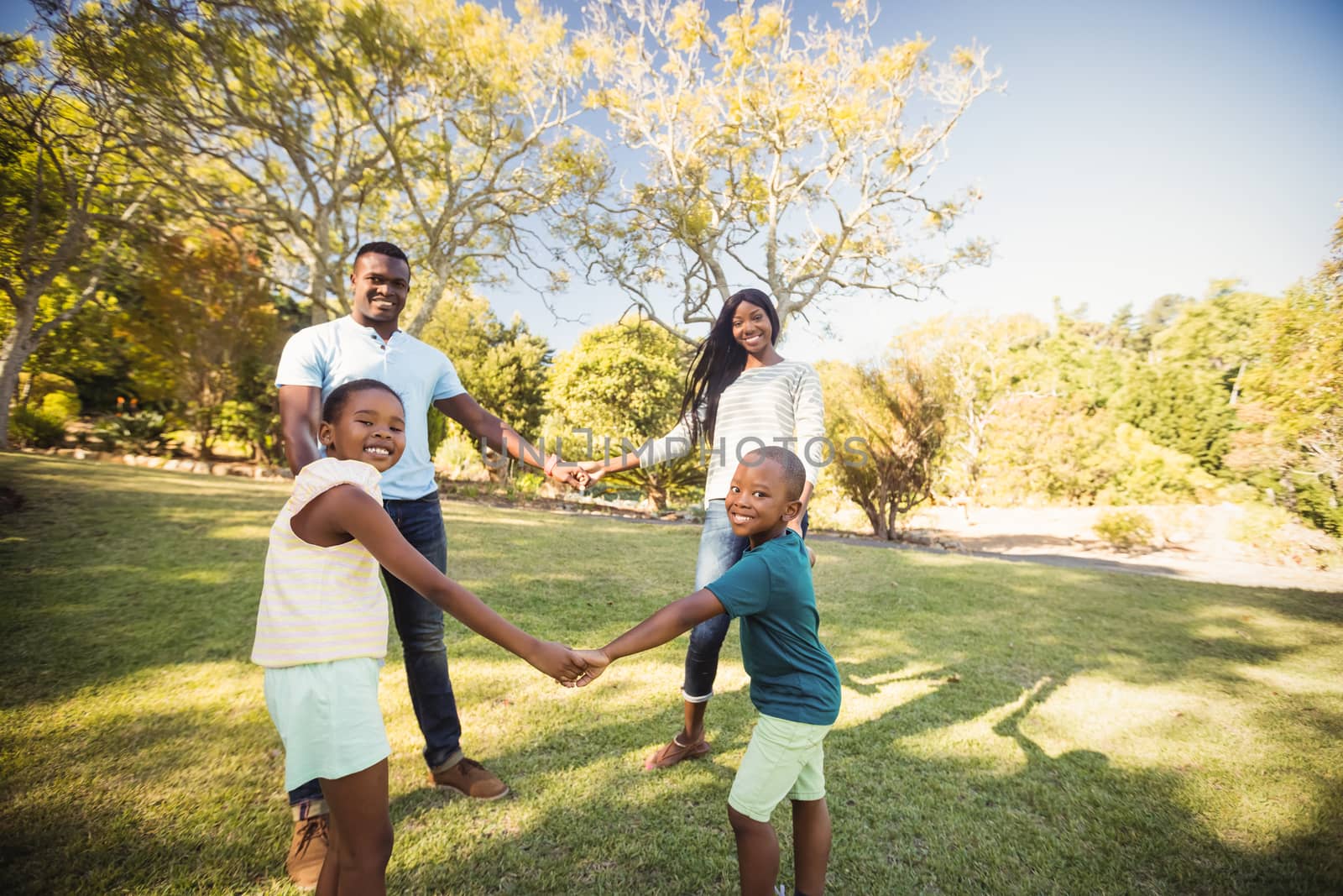 Happy family enjoying together at park