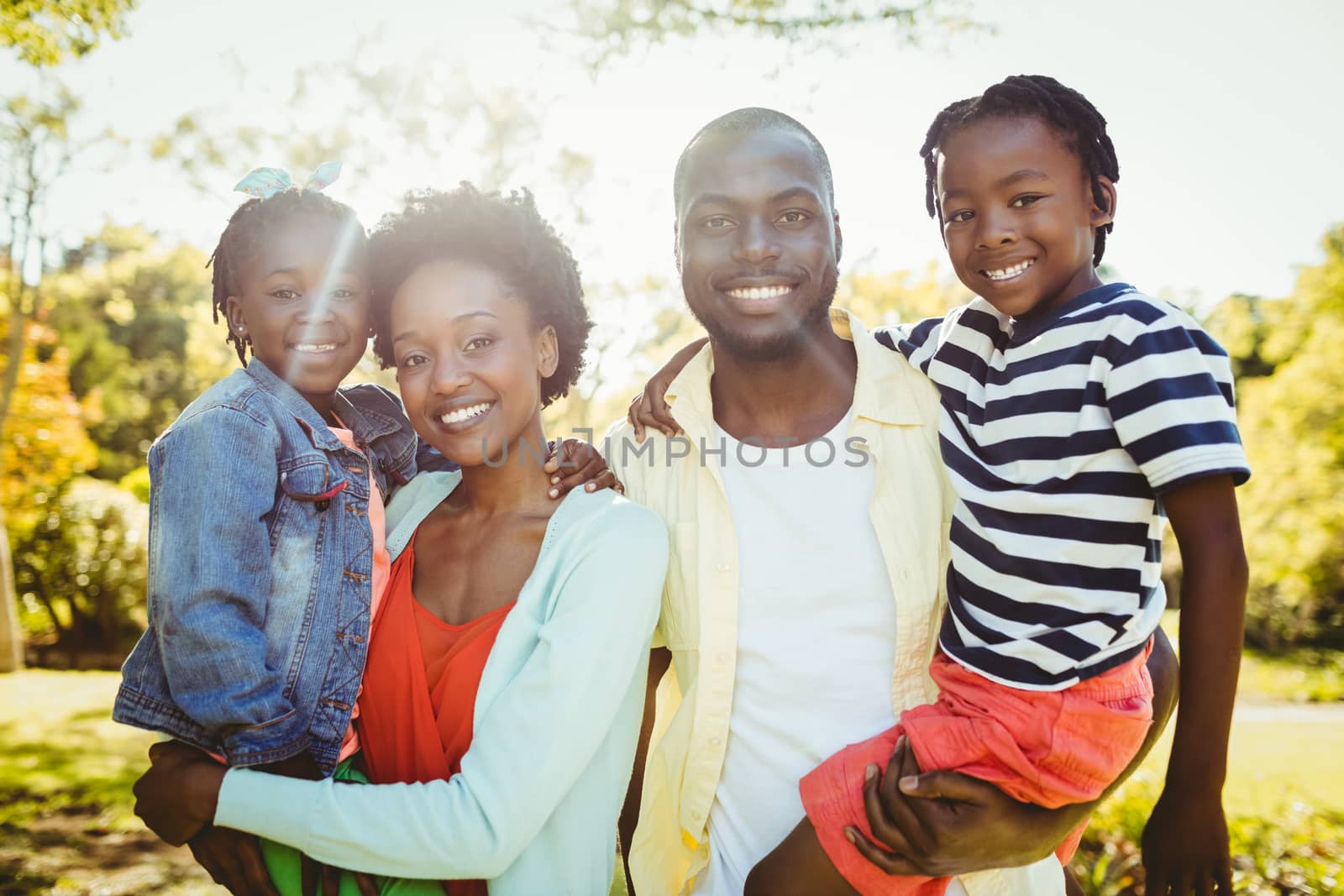 Happy family posing together by Wavebreakmedia