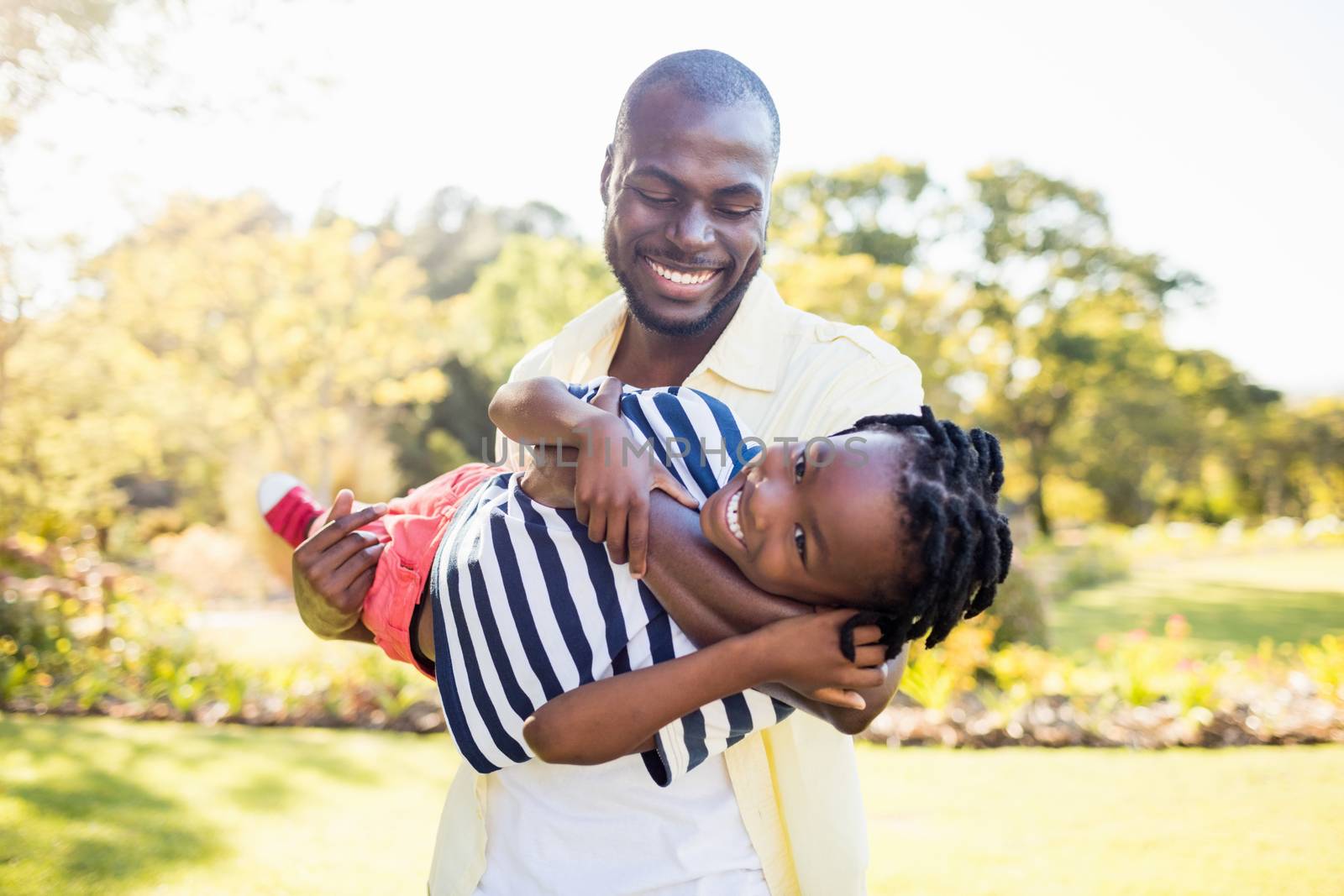 Happy family posing together by Wavebreakmedia