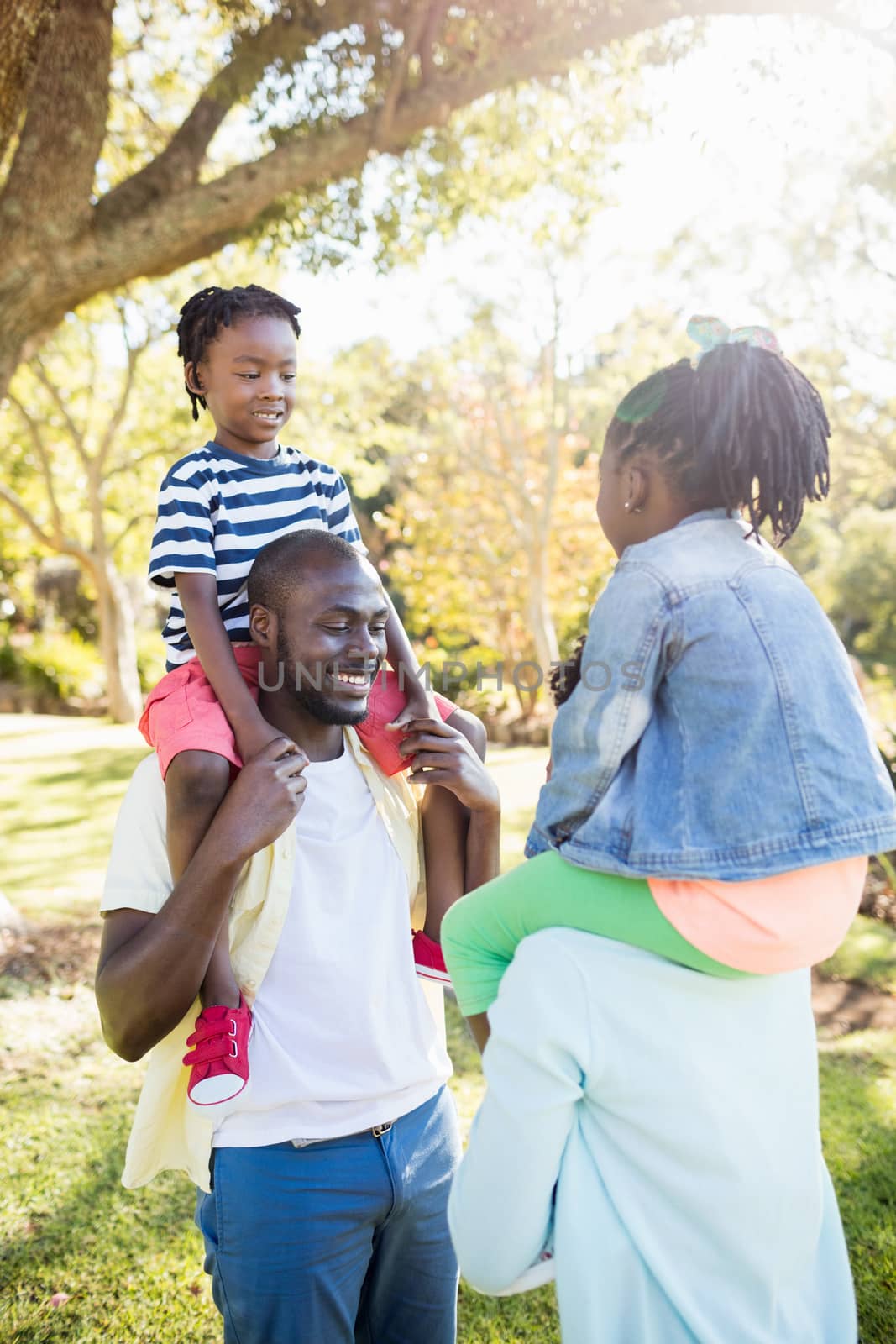 Happy family posing together at park