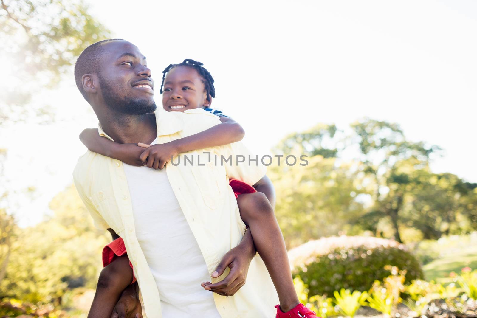 Happy family posing together at park