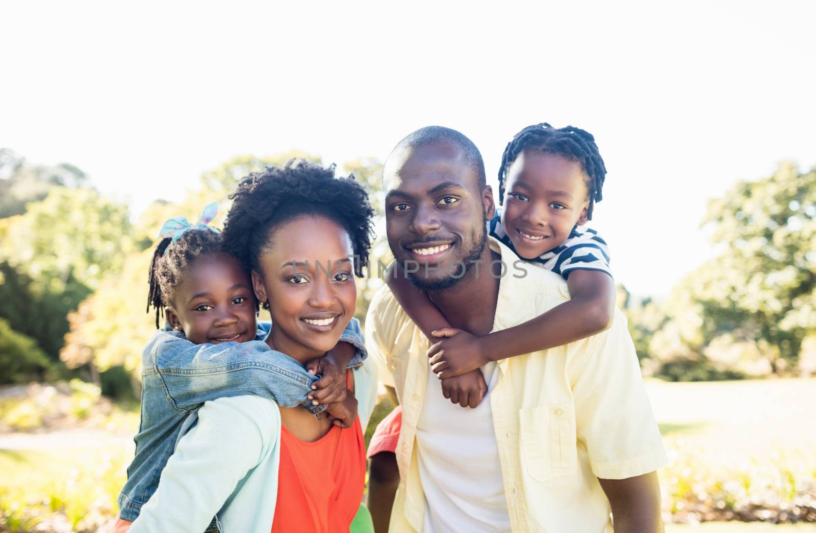 Happy family posing together by Wavebreakmedia