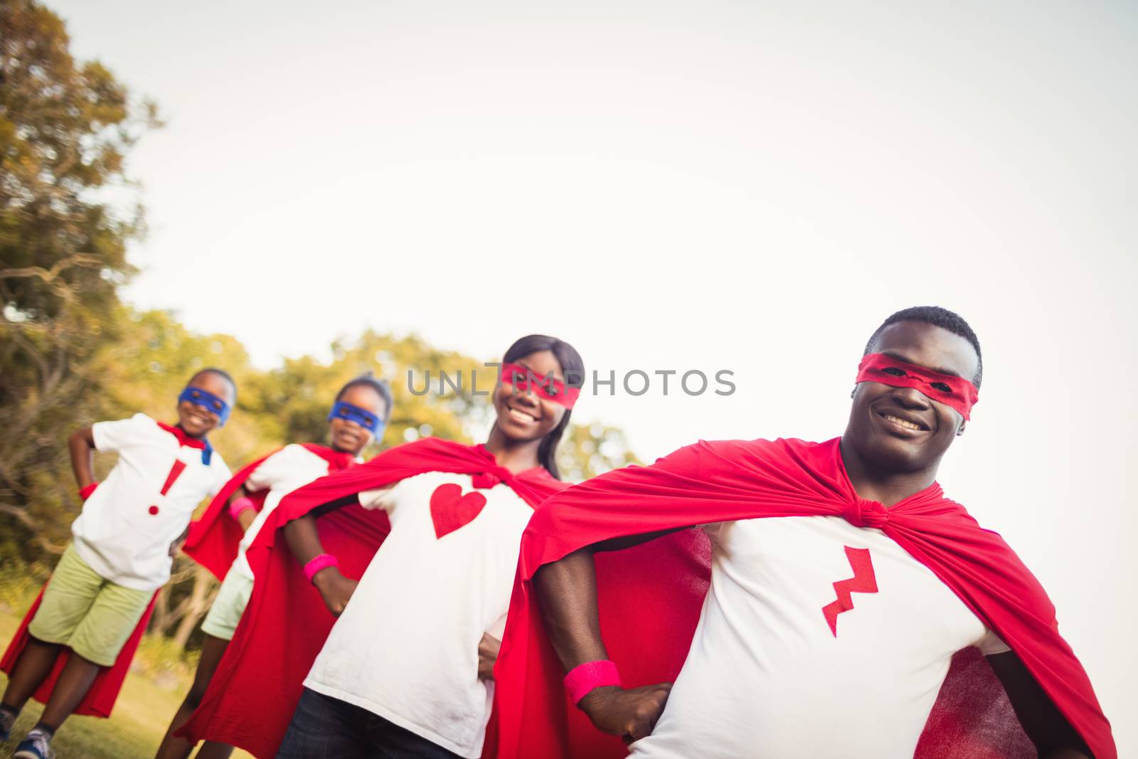 Happy family posing together by Wavebreakmedia