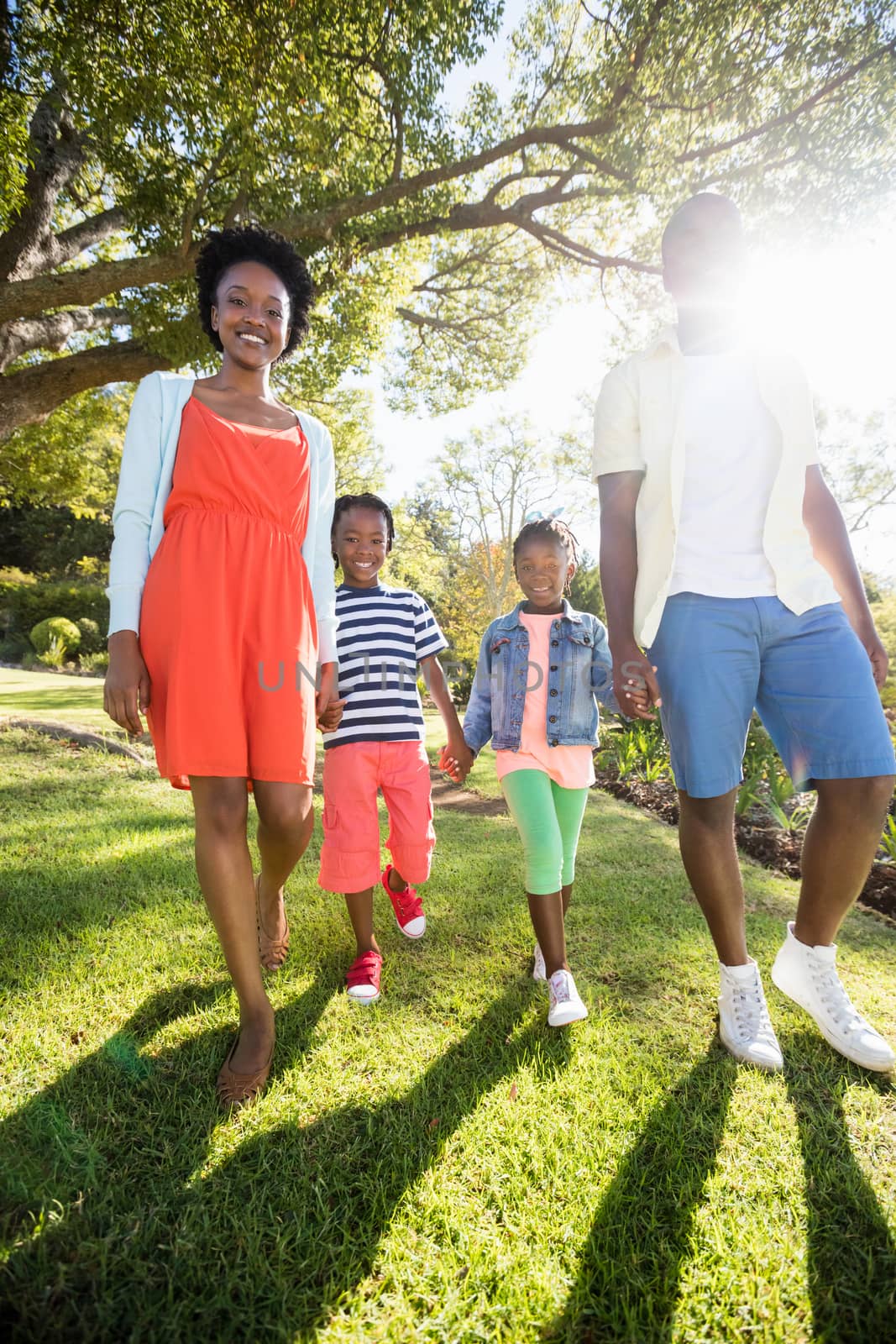 Happy family posing together at park