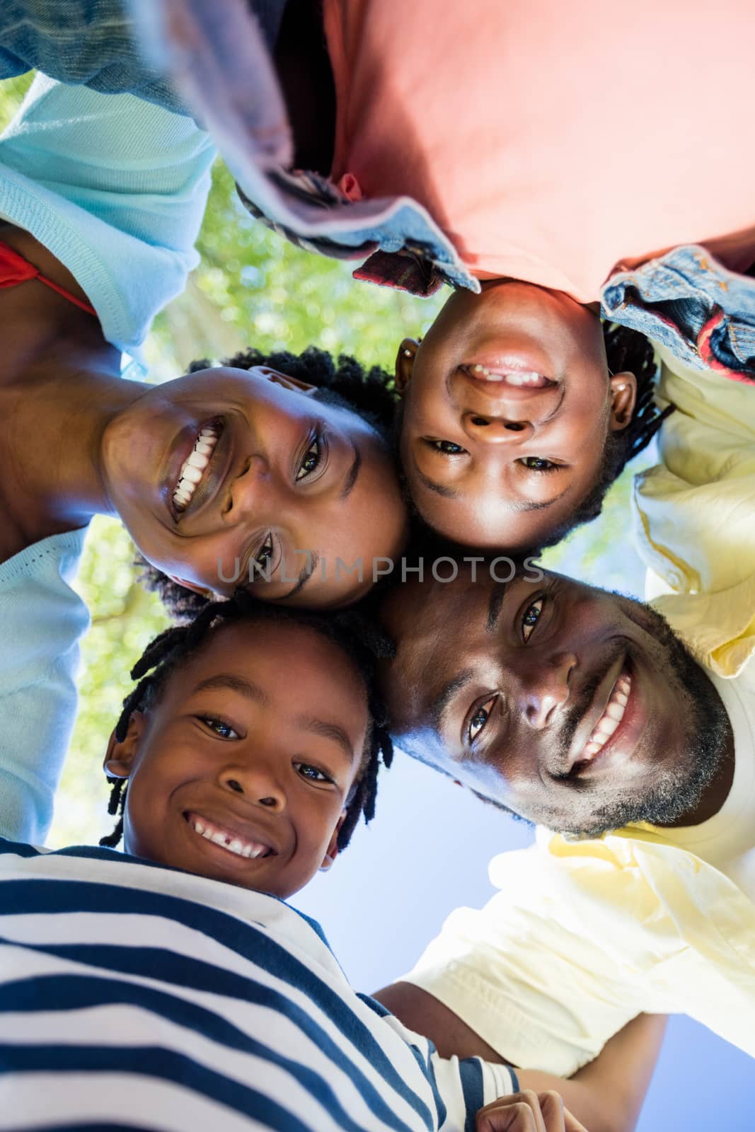 Happy family posing together at park