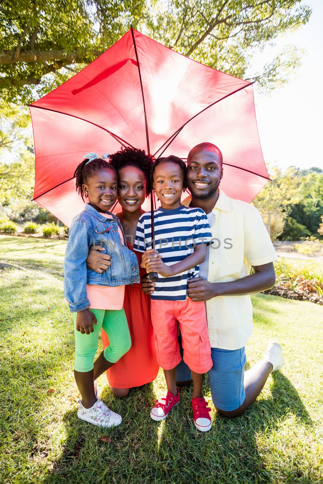 Happy family posing together by Wavebreakmedia