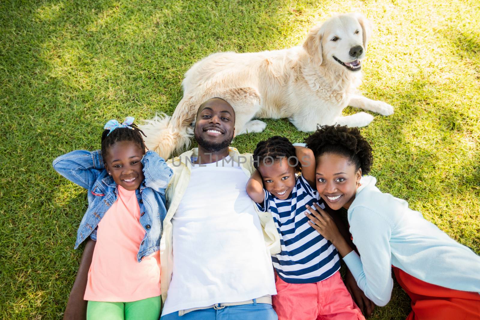 Happy family posing together by Wavebreakmedia