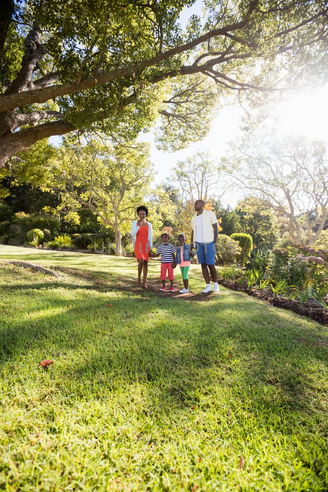 Happy family posing together by Wavebreakmedia