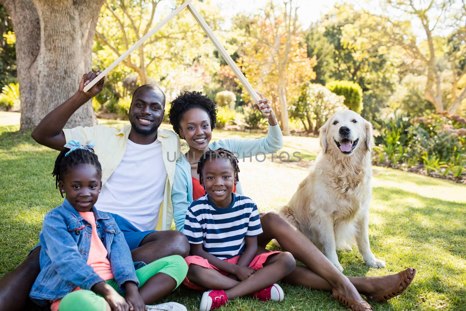 Happy family posing together at park