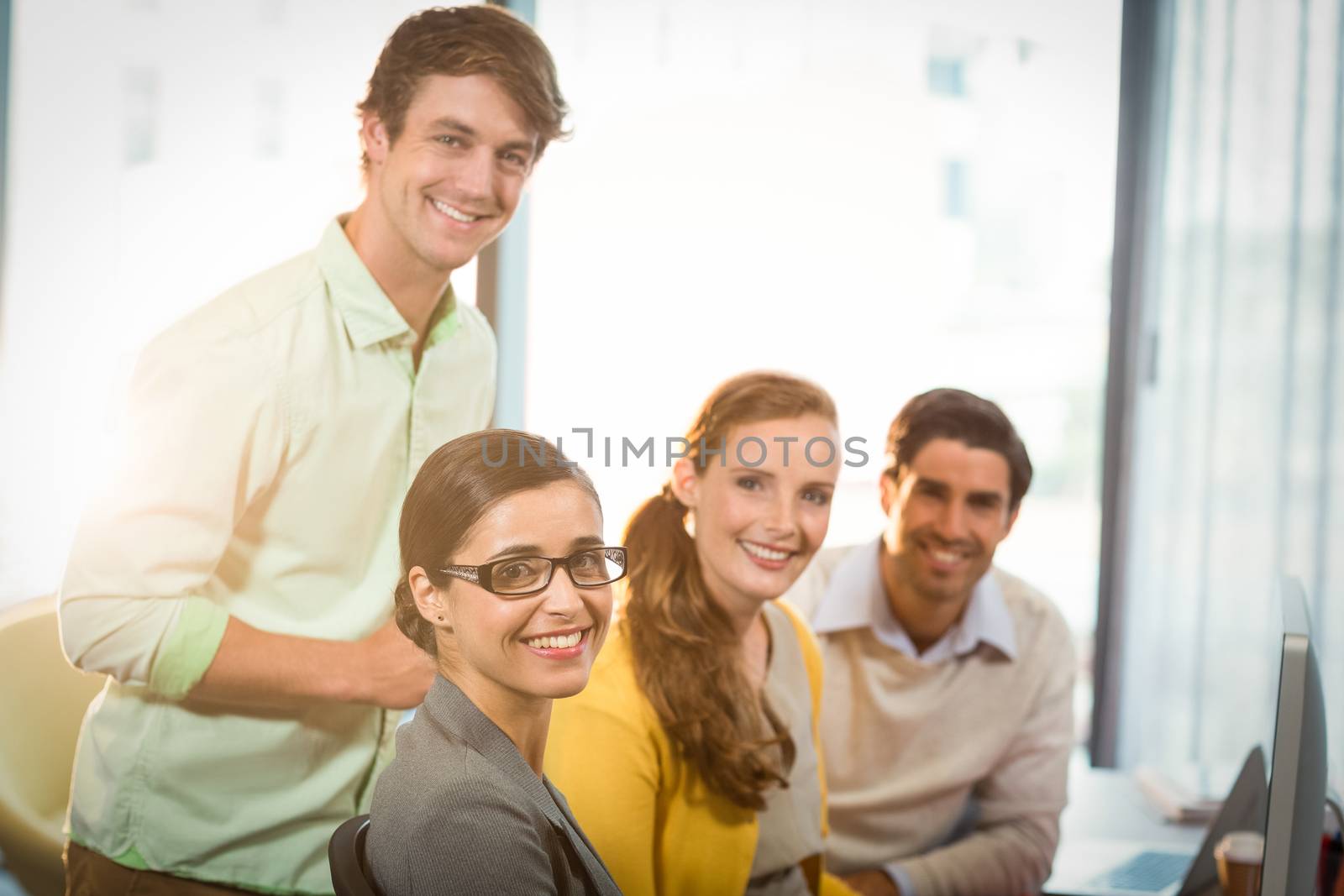 Portrait of business people smiling in office