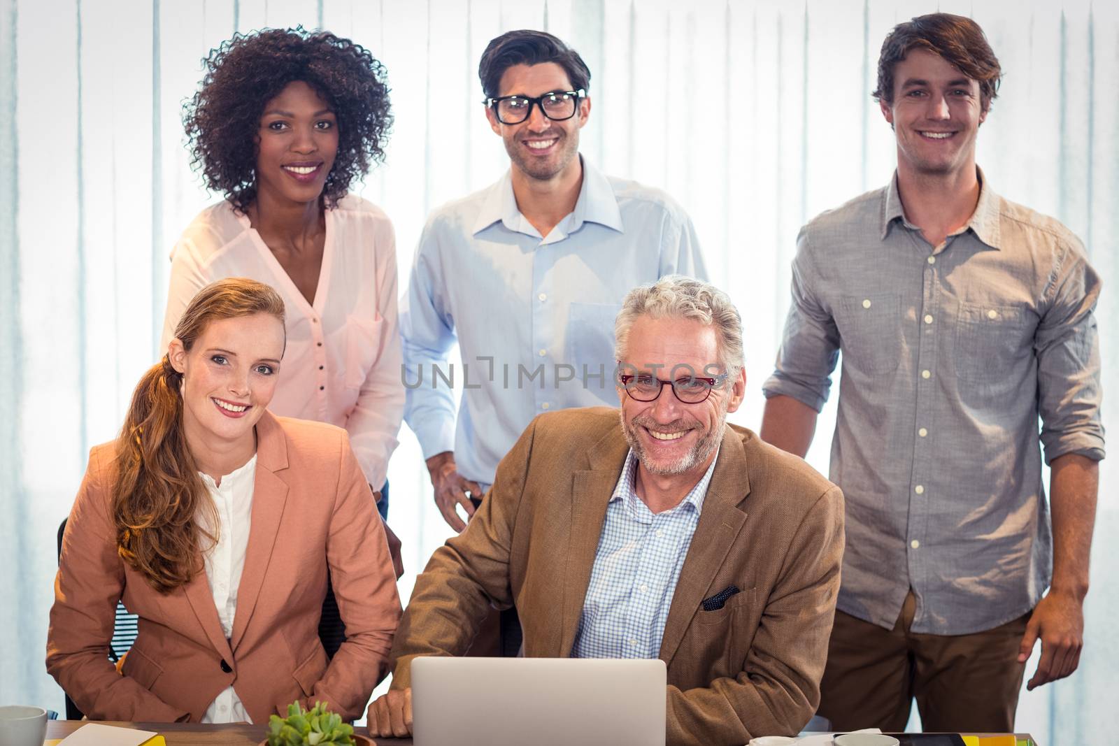 Portrait of business people smiling by Wavebreakmedia