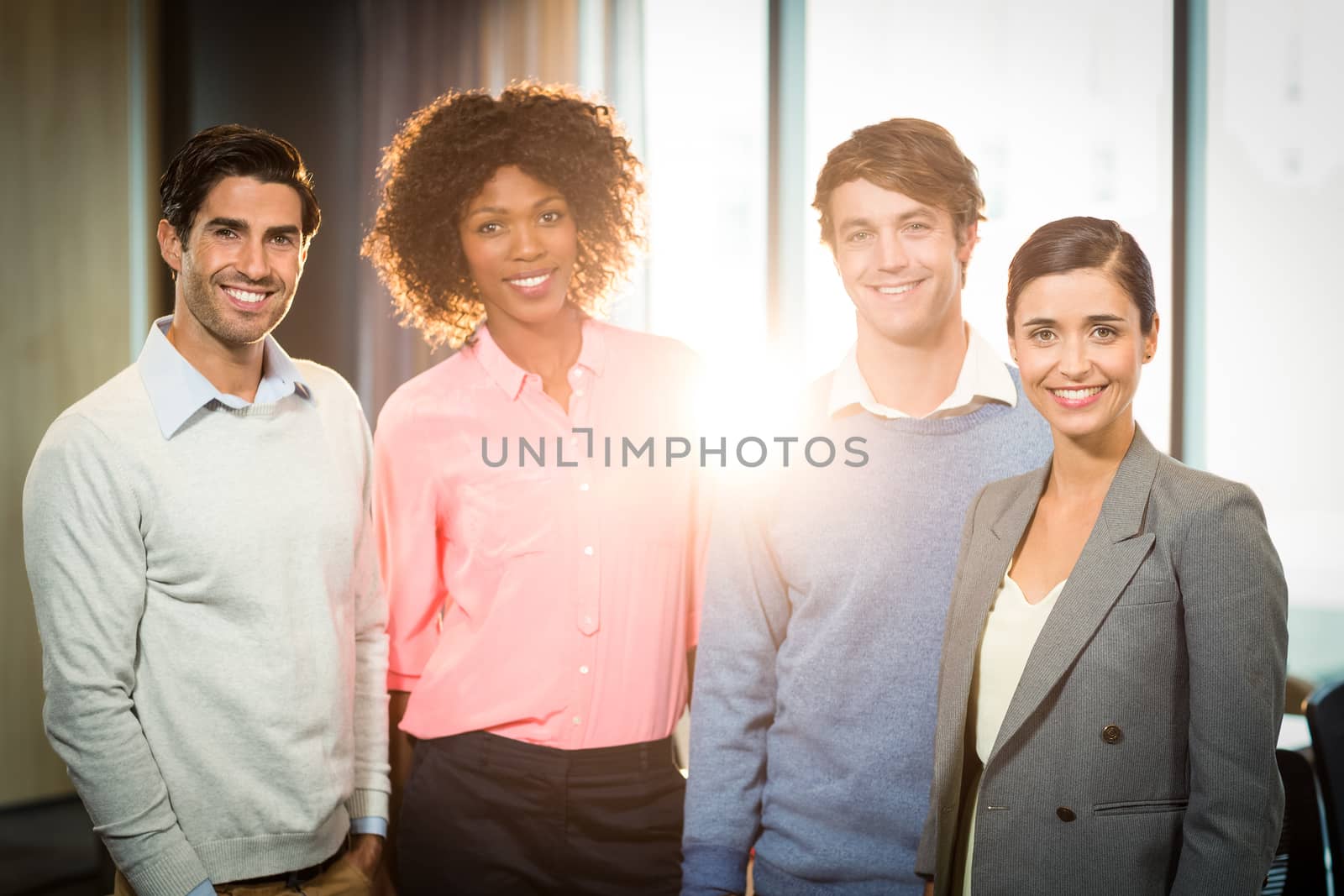 Portrait of business people smiling in office