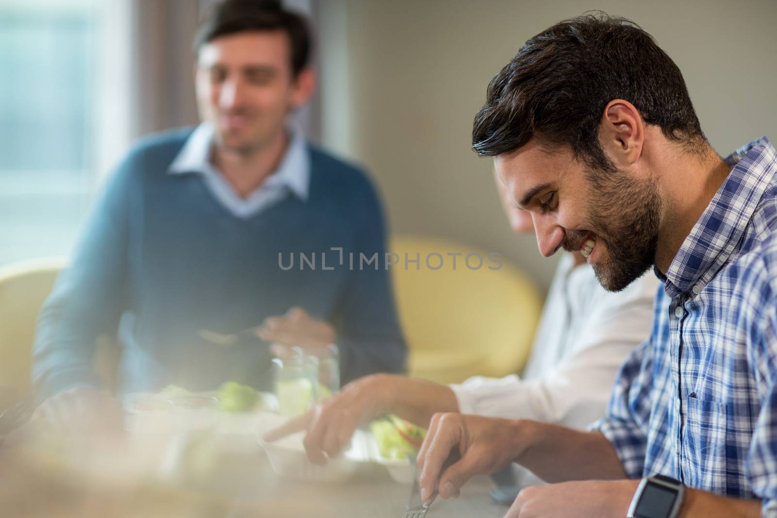 Business people having breakfast in the office