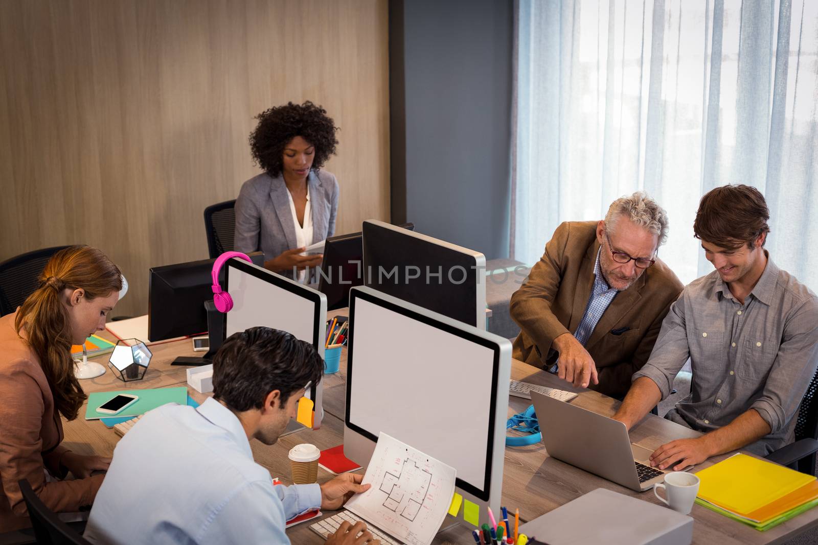 Business people working in office by Wavebreakmedia