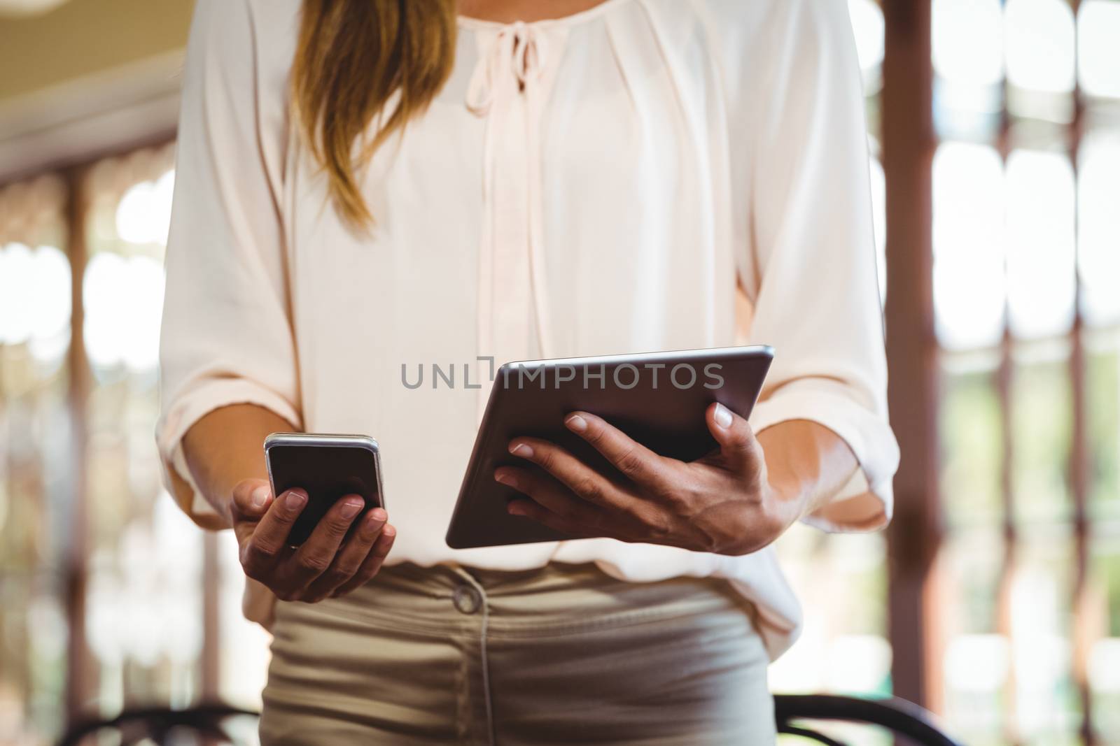 Woman using technology in a restaurant