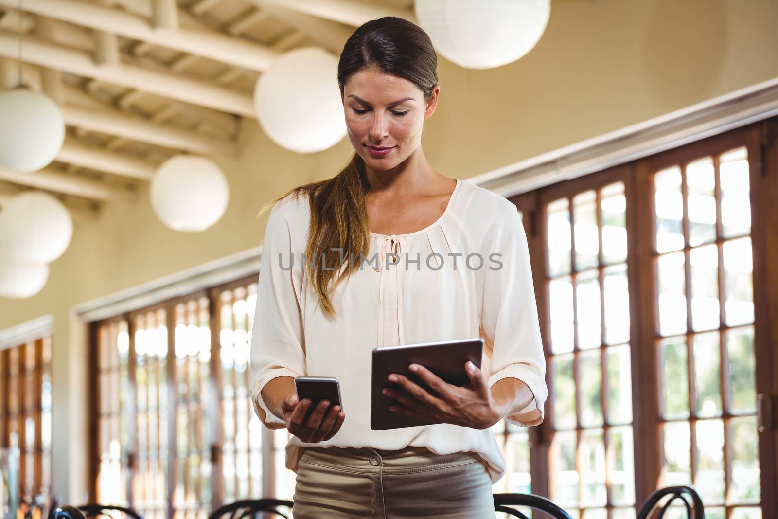 Woman using technology in a restaurant