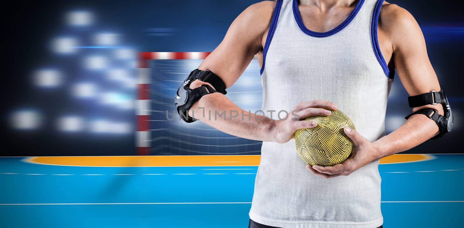 Composite image of mid section of athlete man holding ball  by Wavebreakmedia