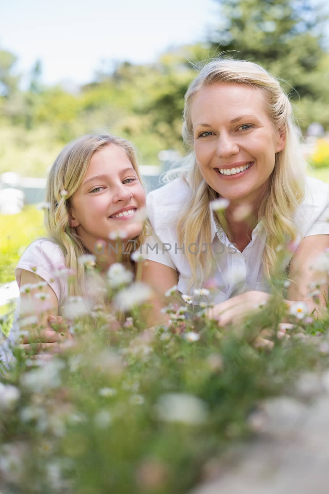 Mother and daughter smiling in park by Wavebreakmedia