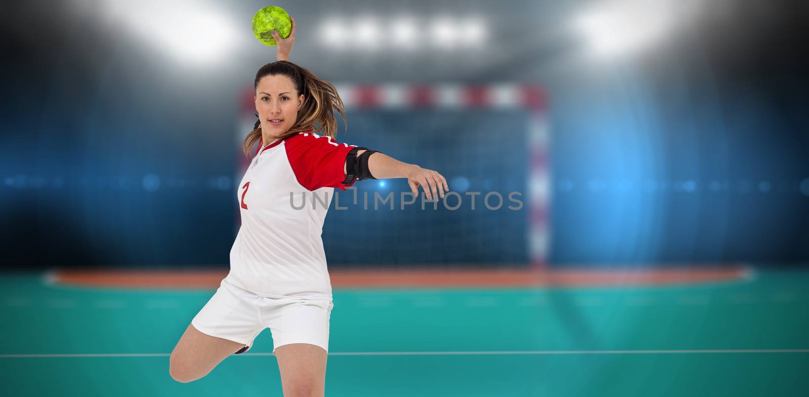 Sportswoman throwing a ball  by Wavebreakmedia