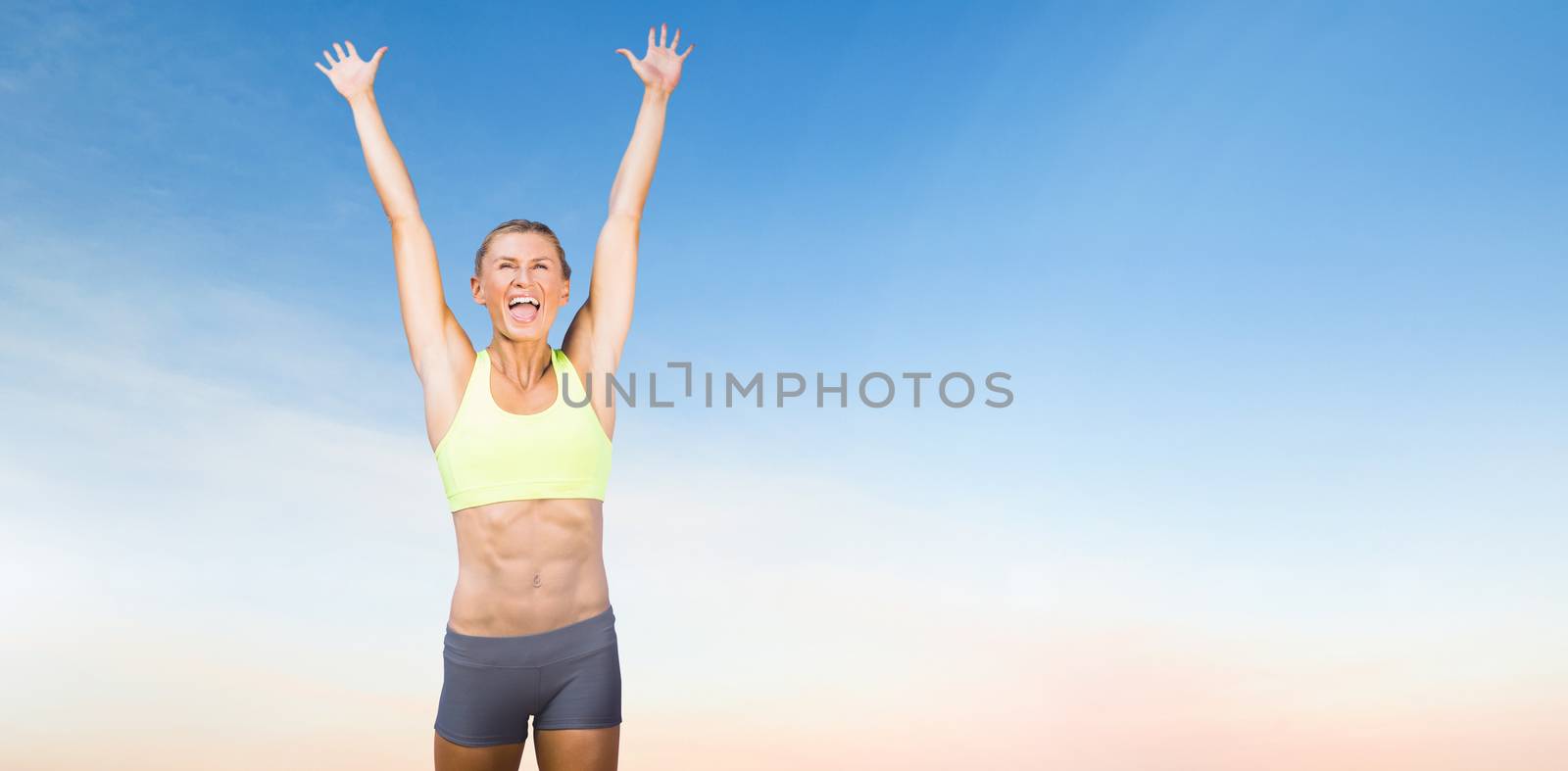 Woman cheering for success  by Wavebreakmedia