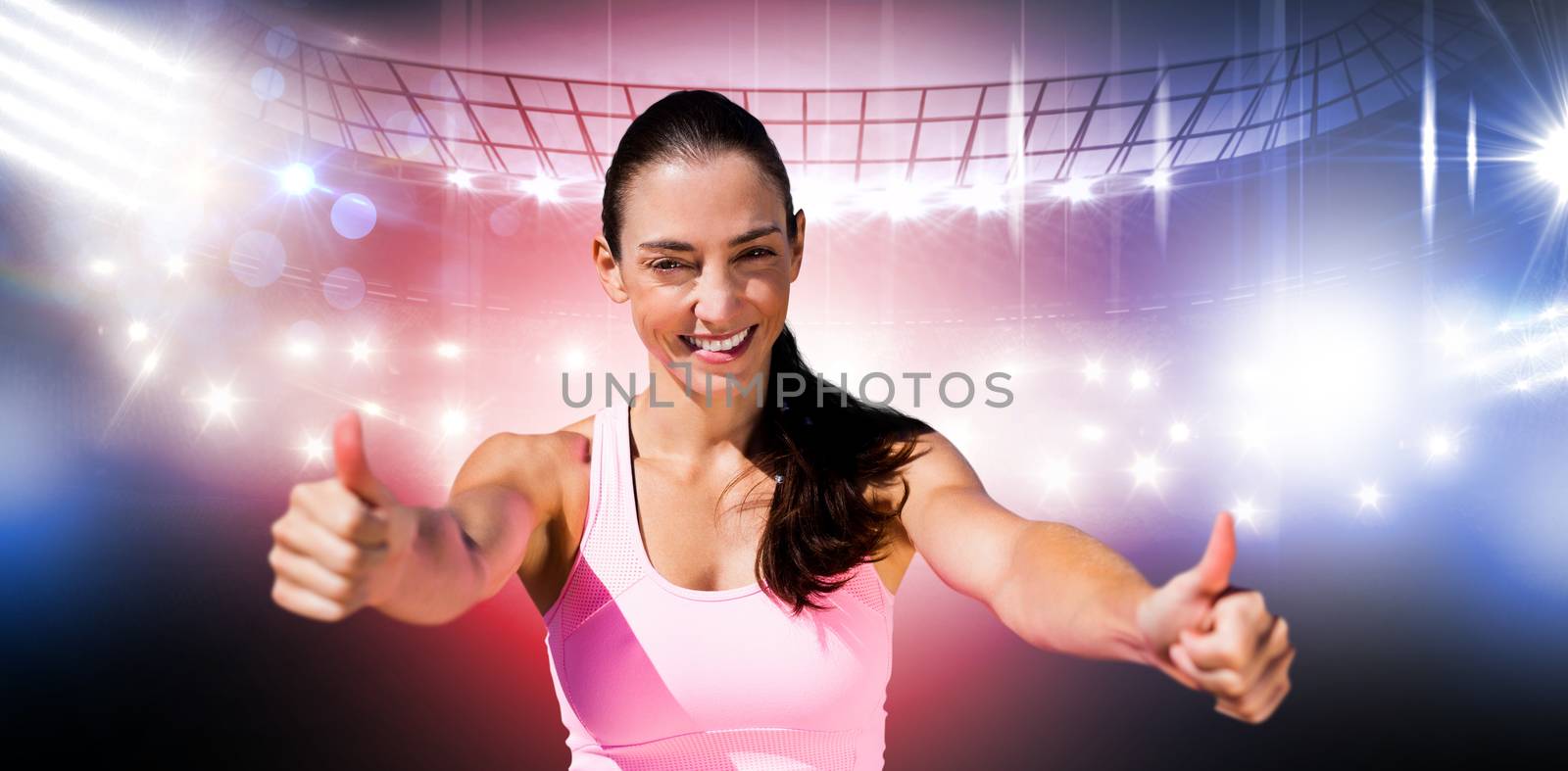 Composite image of portrait of sportswoman is smiling with thumbs up by Wavebreakmedia