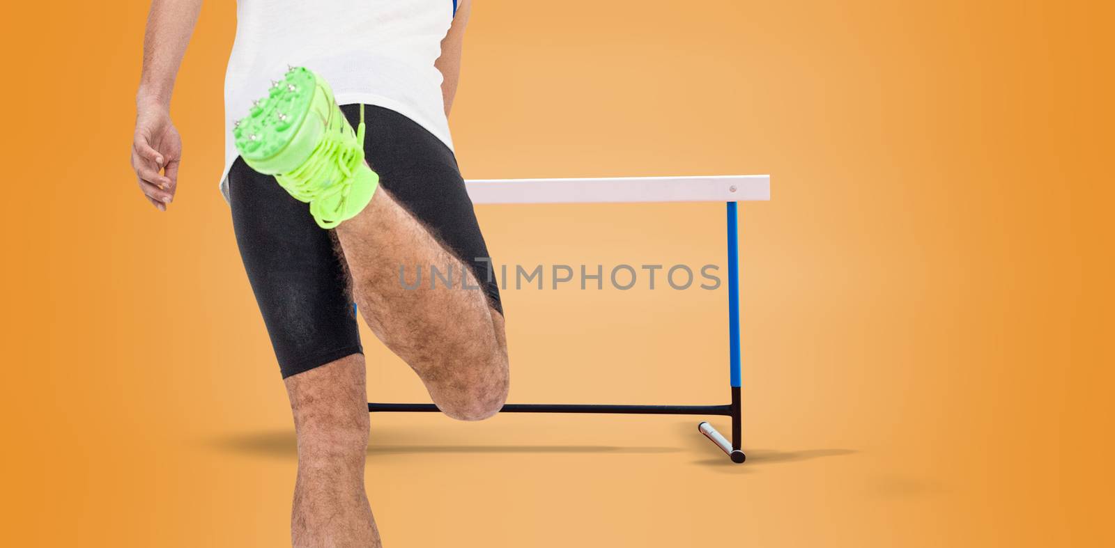 Rear view of male athlete running on isolated orange background