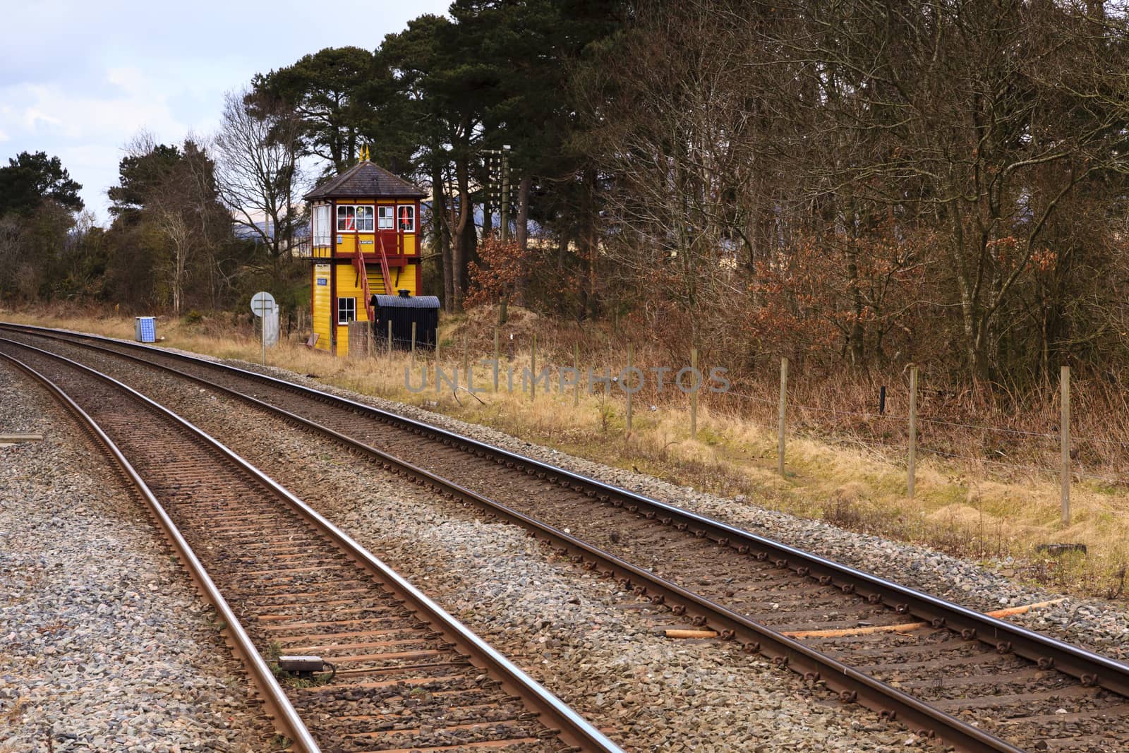 A traditional railway signal box viewed from Armathwaite station on the historic Settle to Carlisle railway in northern England.