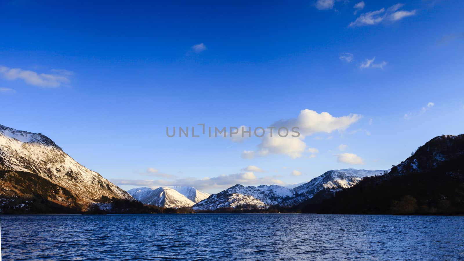 The view across Ullswater through Patterdale valley in the English Lake District national park.