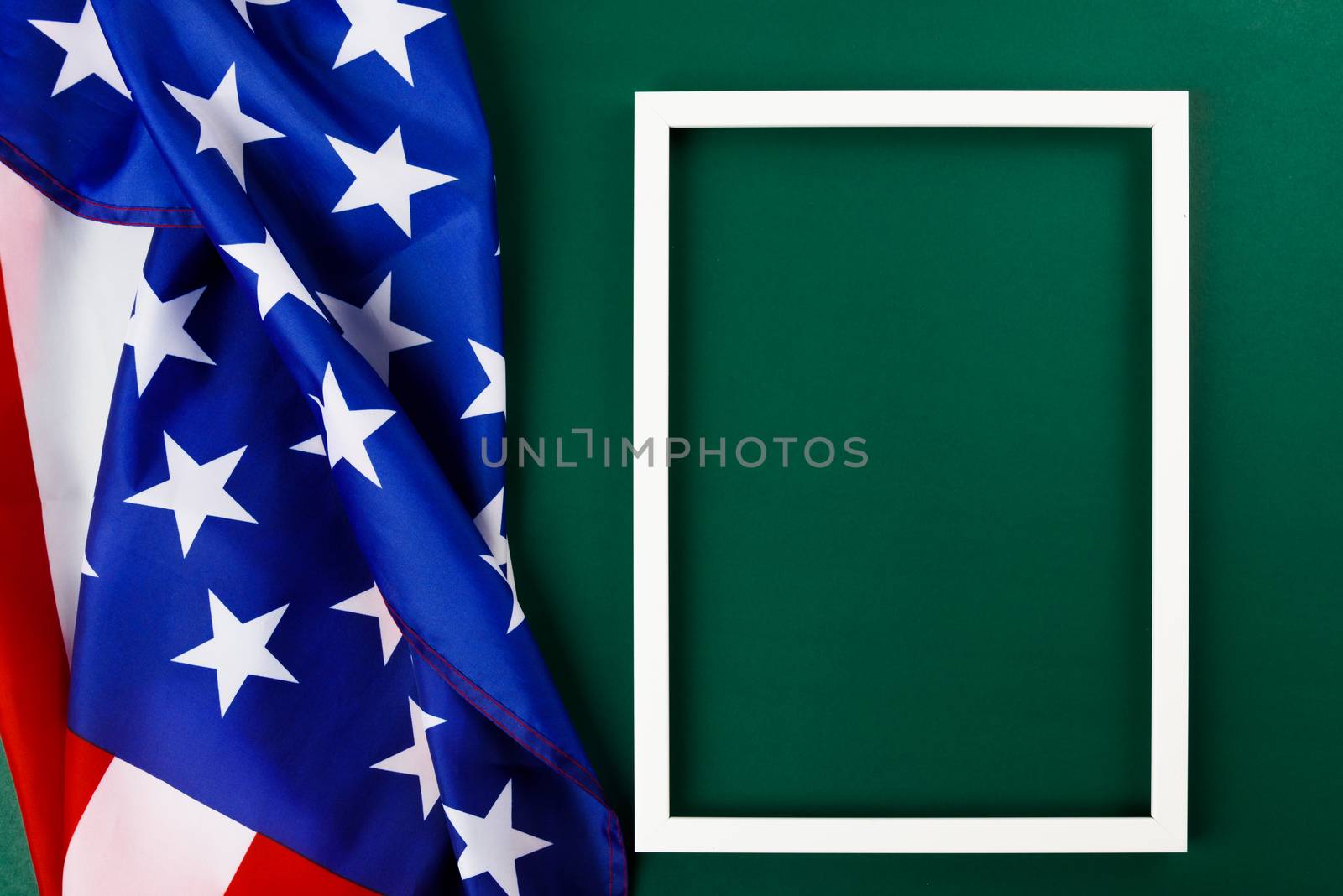 President's Day Concept, flat lay top view, America Flag and photo frame on Olive green background with copy space for your text