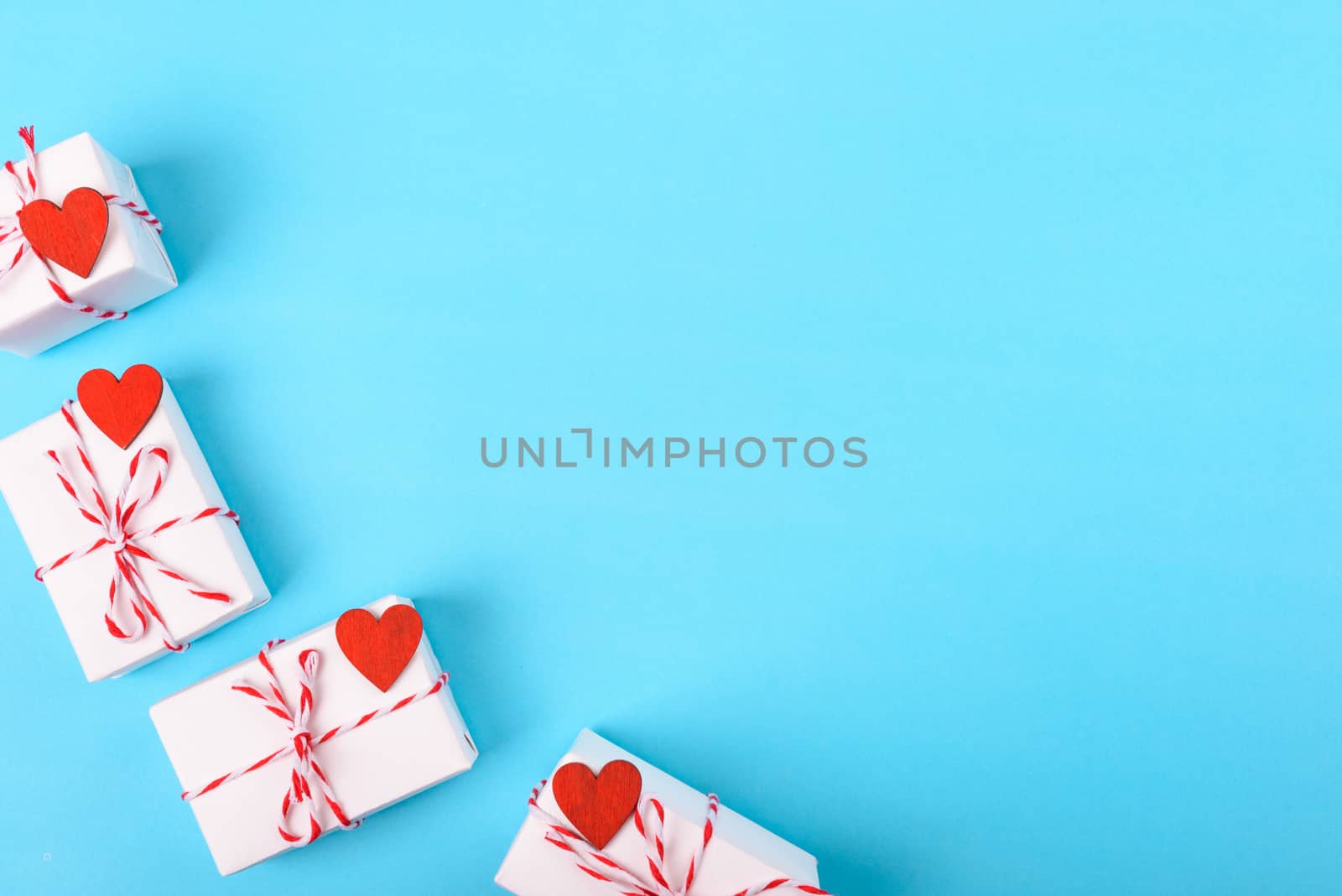 Valentine's day Concept, flat lay top view, White Gift Box and Red Heart on Blue background with copy space for your text