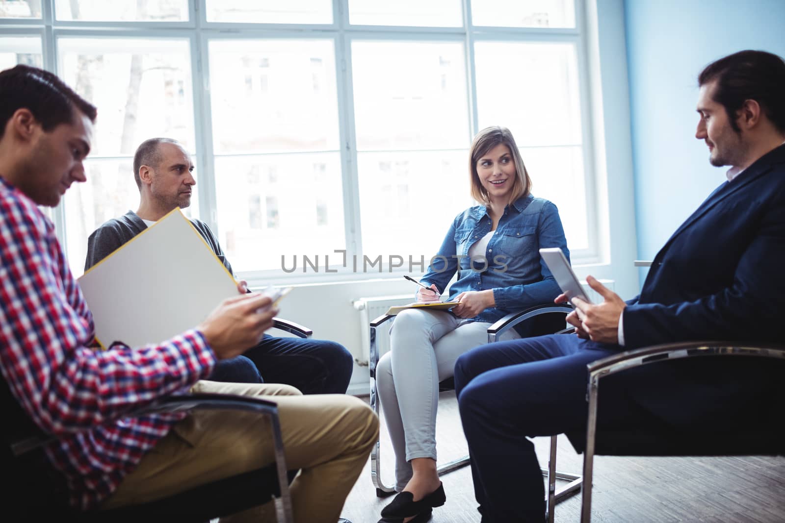 Business people discussing during meeting by Wavebreakmedia