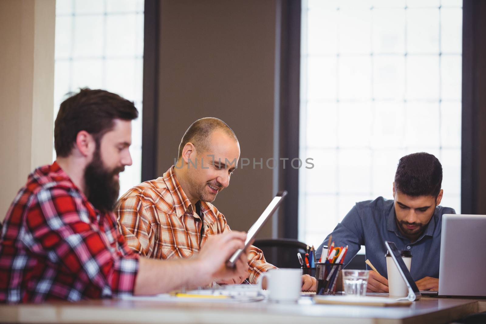 Business people working at desk in creative office