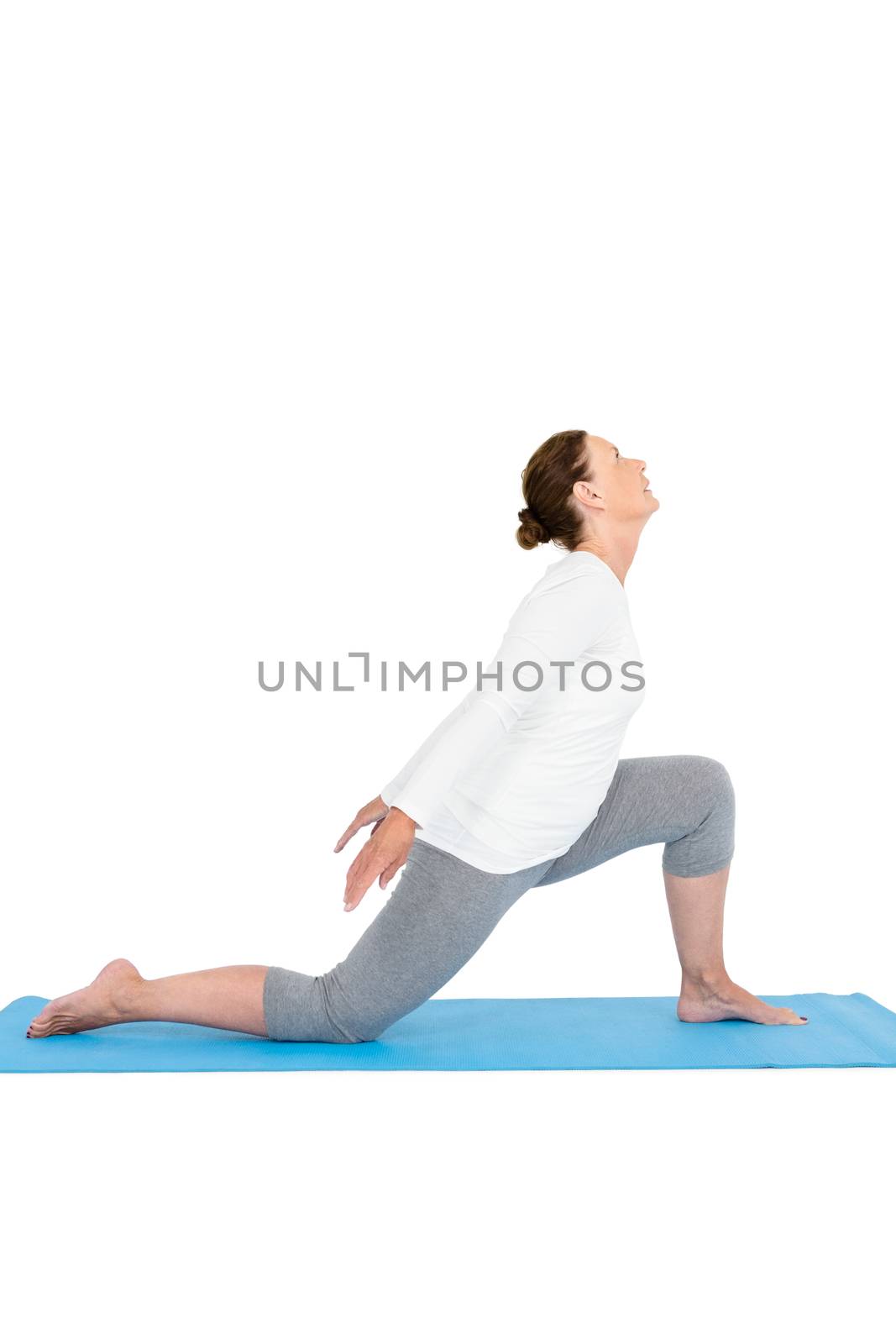 Side view of woman exercising by Wavebreakmedia