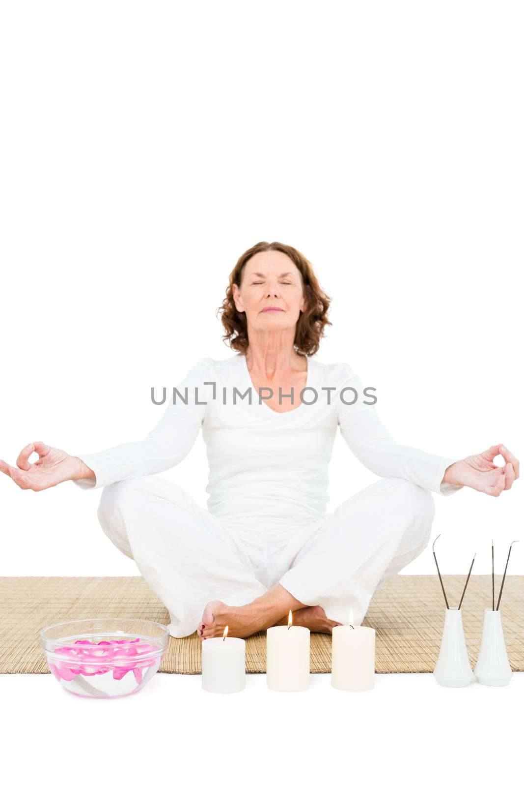 Full length of mature woman meditating by Wavebreakmedia