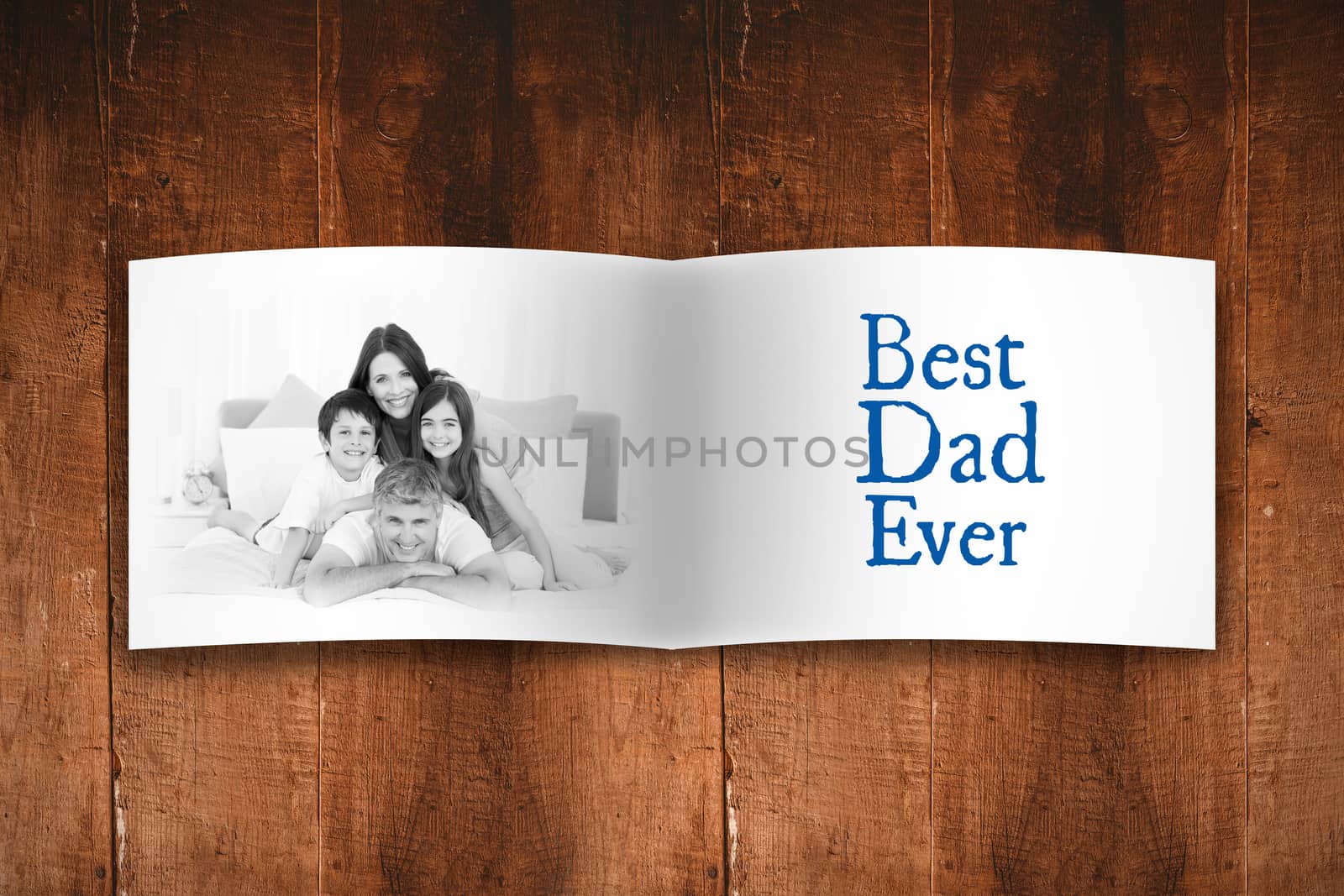 Attractive smiling father with family against overhead of wooden planks