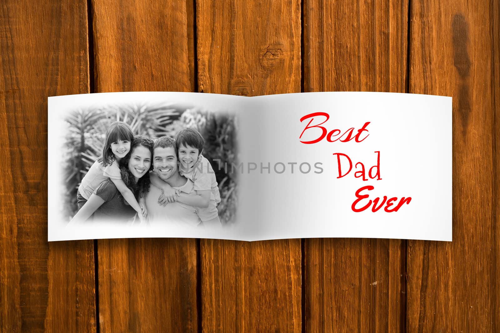 Attractive smiling father with family against overhead of wooden planks
