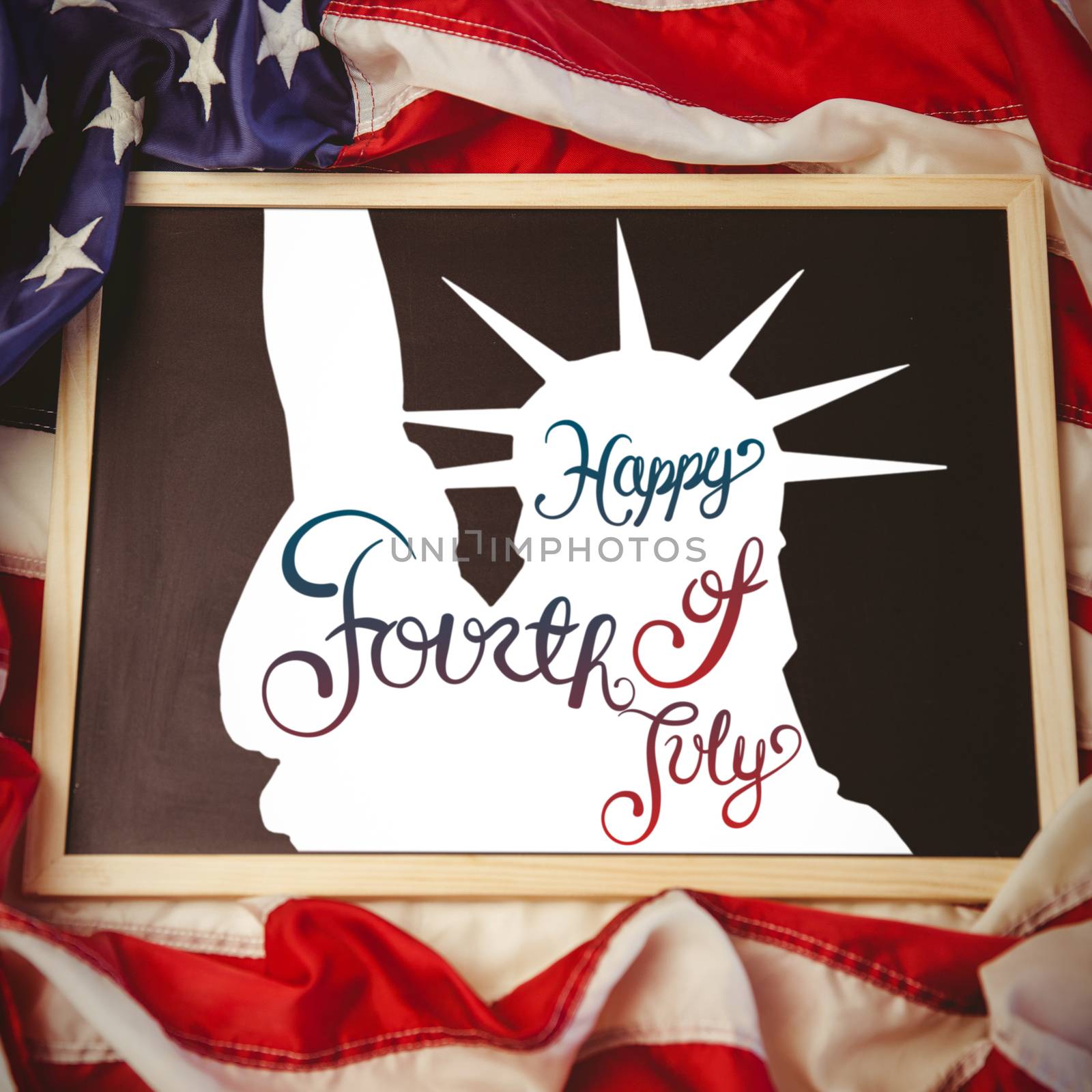 Independence day graphic against american flag on chalkboard