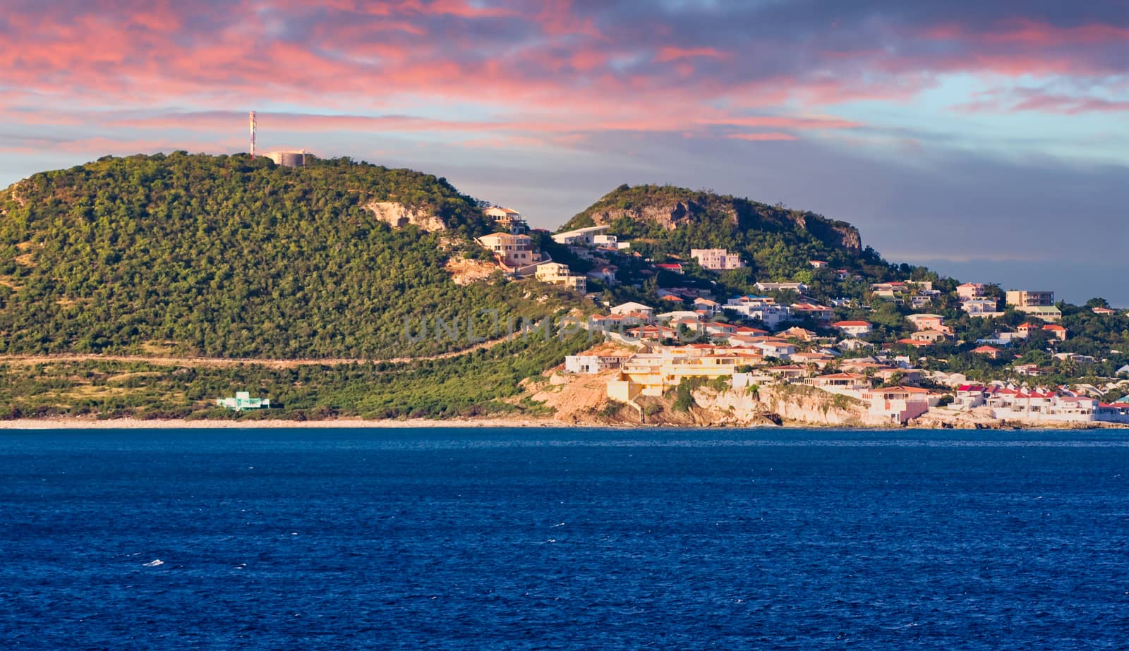 Buildings on Hilly Coast at Sunrise by dbvirago