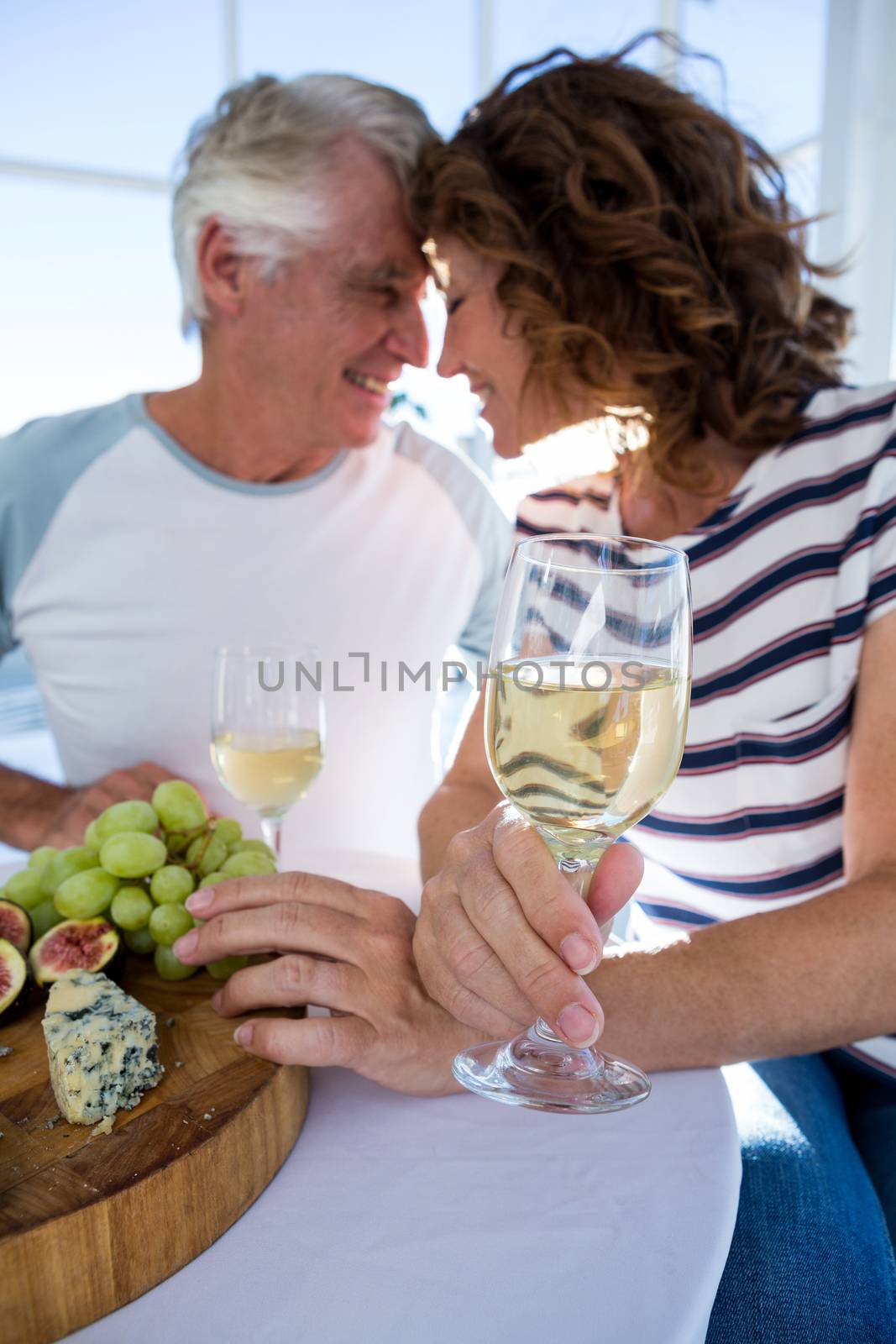 Romantic couple with champagne glasses by Wavebreakmedia