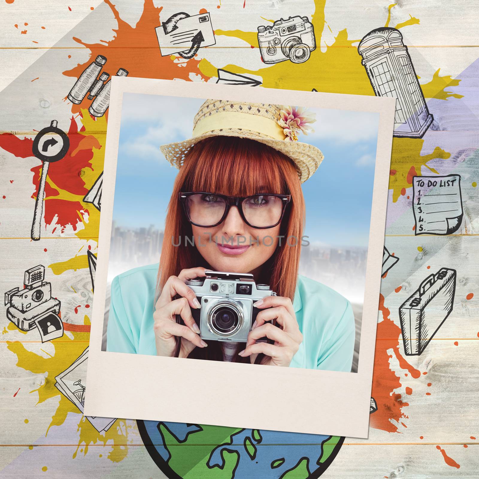 Portrait of a smiling hipster woman holding retro camera against colored wood